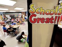 First graders prepare their folders in the cubbies inside their classrooms at the Casimir Pulaski school, as students across New Bedford return to school.  [ PETER PEREIRA/THE STANDARD-TIMES/SCMG ]